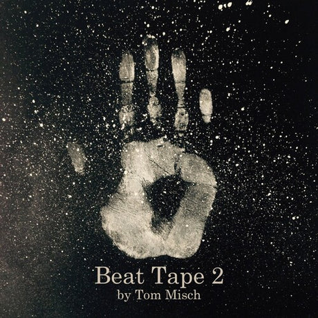 Handprint on a dark background with 'Beat Tape 2 by Tom Misch' text