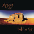 Album cover with a dilapidated building in a desert landscape and text at the top and bottom.