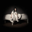 Person sitting on a bed in a dark room, wearing a white dress.