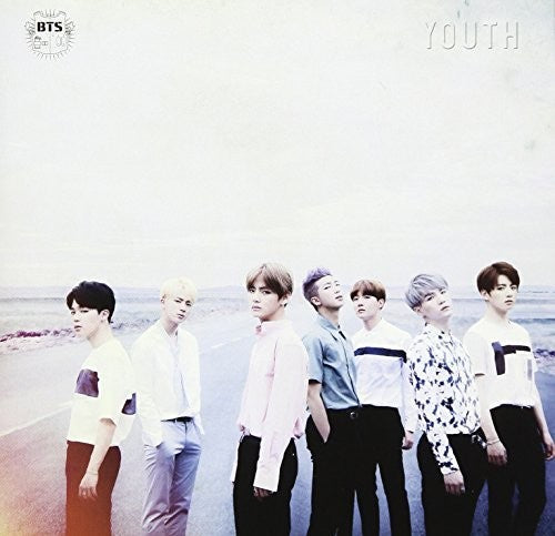 Group of people standing on a beach with 'BTS' and 'YOUTH' text.