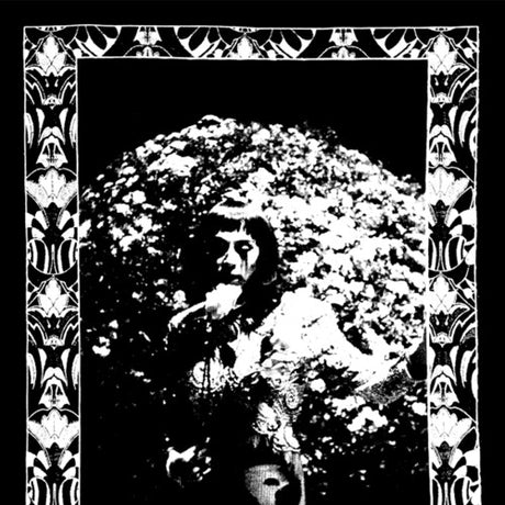 Black and white album cover with decorative border featuring a person holding flowers.