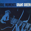 Album cover of 'Idle Moments' by Grant Green featuring a close-up of hands playing guitar.
