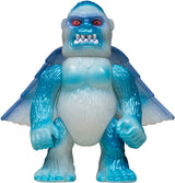 Toy figure of a blue and white creature with red eyes on a white background