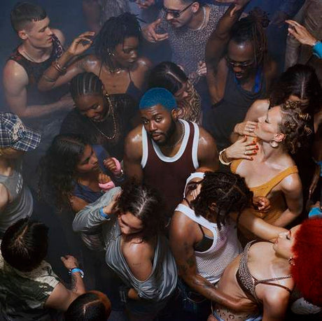 Group of people in a crowded indoor setting