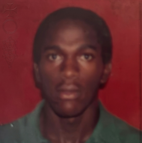 Person wearing a green shirt against a red background