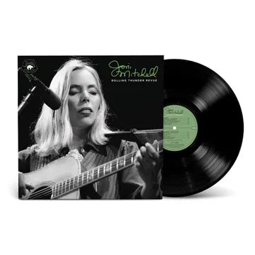 Vinyl record with a cover featuring a person playing guitar, on a white background