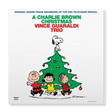 Album cover for 'A Charlie Brown Christmas' by Vince Guaraldi Trio featuring cartoon characters around a Christmas tree.