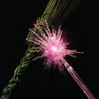 Fiber optic cable with a pink light against a black background