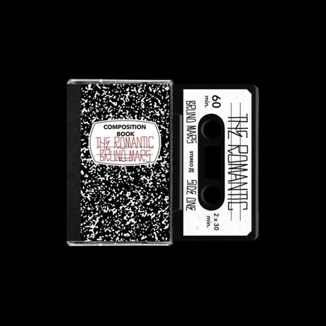Cassette tape with black and white design and text on a black background
