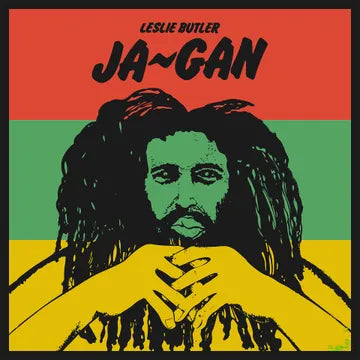 Album cover with a stylized illustration of a person with dreadlocks, set against a red, green, and yellow background with text 'Leslie Butler Ja-Gan'.