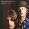 Album cover with two individuals wearing cowboy hats and a text overlay.