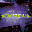 Album cover for 'After Dark Onira' with a purple gradient and text, featuring a DJ setup.