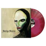 Marilyn Manson 'One Assassination Under God: Chapters 2' vinyl record album with the illustrated cover on the left and a translucent pink-red record partially visible on the right, shown on a plain white background.