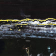 Album cover art for Gilla Band's 'Pugnello' featuring an abstract, textured black background with horizontal bands of yellow, white, and gray, and a small, indistinct figure near the bottom.