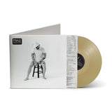 Mule's 'Smile Again' vinyl record album shown with the outer sleeve open, revealing a pale gold translucent record partially pulled out. The sleeve features a black-and-white photo of the artist seated on a stool.