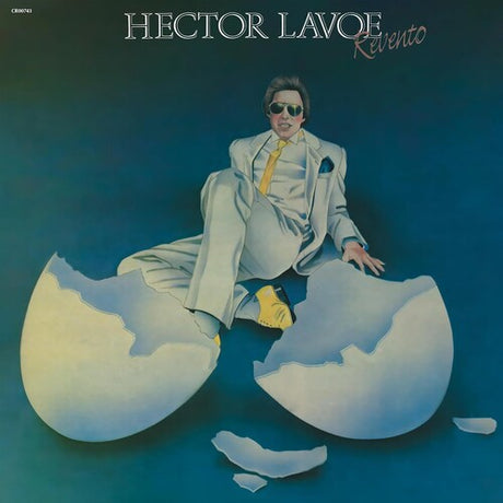 Album cover with a person sitting inside an eggshell against a blue background, featuring the text 'Hector Lavoe Revento'.