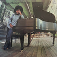 Album cover with a person sitting on a piano, large leaves in the background, and text 'Patrice Rushen: Preclusion' at the top.