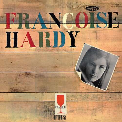 Album cover with 'Francoise Hardy' text on a wooden background