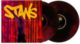 Vinyl records with a red and yellow cover featuring a silhouette of a person holding a microphone.