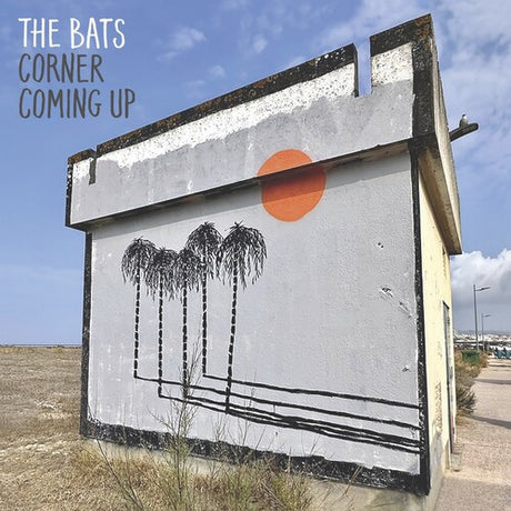 Artistic depiction of palm trees and a sun on a billboard with 'The Bats' and 'Corner Coming Up' text.