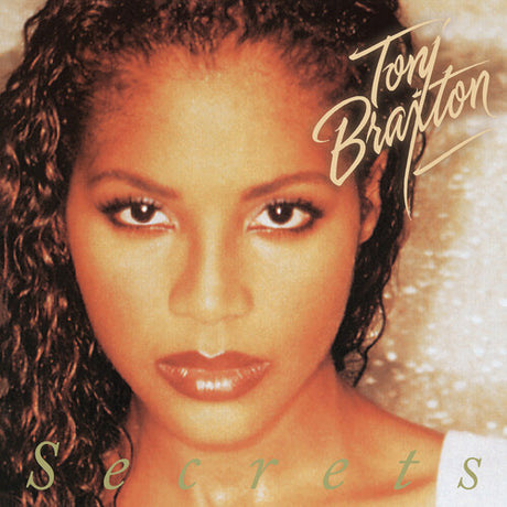 Album cover featuring a woman's face with 'Tony Brown' and 'Secrets' text.