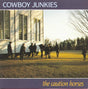 Album cover with people walking on grass near a building, featuring the text 'Cowboy Junkies' and 'The Caution Horses'.