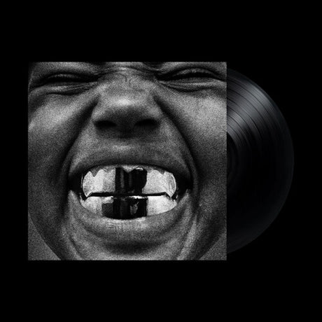 Vinyl record with a black and white image of a face on the cover