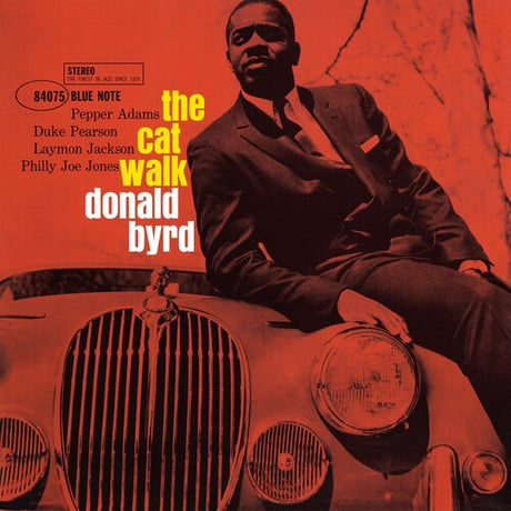 Album cover with a man sitting on a car, featuring text about 'The Cat Walk' by Donald Byrd.