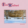 Finn Wozhard 'Fire From The Hip' album cover featuring a pink background with the artist's name in ornate red and blue lettering at the top and a central square photograph of two people standing in a snowy outdoor landscape.
