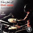 Elvin Jones drum album cover for 'Dear John C.' featuring a dramatic side-profile portrait of the drummer at a kit, with the Impulse! label logo and artist text on a dark background.