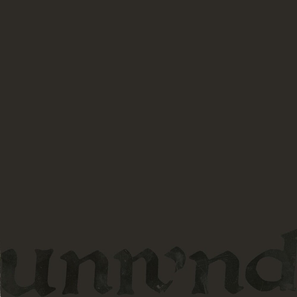 A very dark charcoal gray to black textured background with a faint, low-contrast gothic-style partial word 'unnd' visible along the bottom edge.
