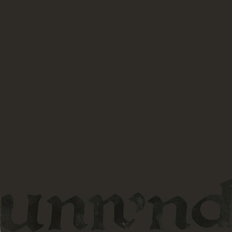 A very dark charcoal gray to black textured background with a faint, low-contrast gothic-style partial word 'unnd' visible along the bottom edge.