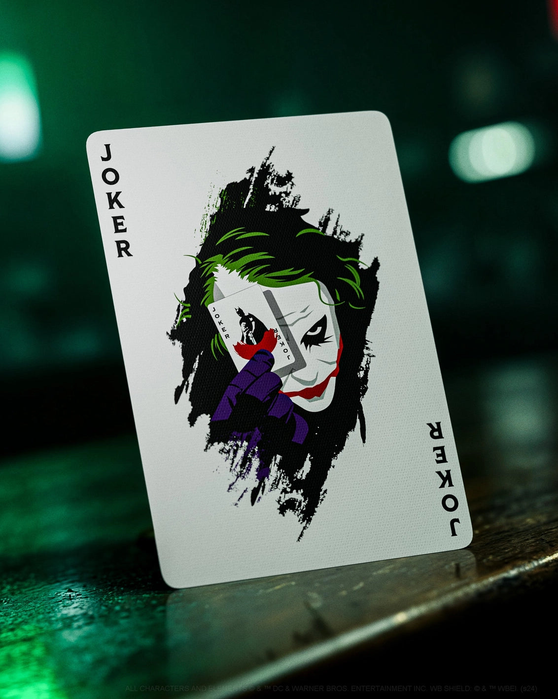 Playing card with Joker design on a dark background