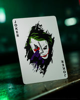 Playing card with Joker design on a dark background