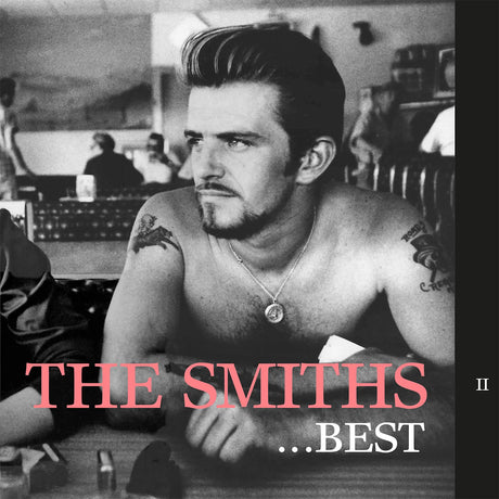 Album cover for 'The Smiths ...Best' featuring a shirtless man with tattoos in a room.