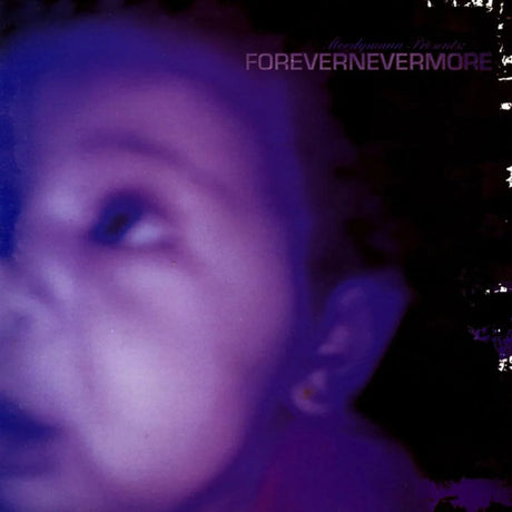 Close-up of a person with text 'FOREVERNEVERMORE' in the background