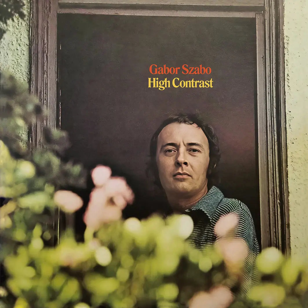 Album cover with a person behind a frame, featuring text 'Gabor Szabo High Contrast'.