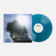Vinyl record album shown with the square cover sleeve and the translucent blue record partially pulled out. The cover features a silhouetted profile with bright light flare and the text 'HER FAVORITE COLO(U)R'.
