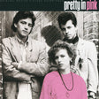 Album cover for 'Pretty in Pink' with a black and white photo of three people and a pink overlay.