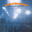 Album cover for 'scattered, smothered & covered' by Hootie & The Blowfish, featuring a blue-toned rainy window scene with blurred lights and the band's name in orange-red text at the top.