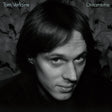 Tom Verlaine 'Dreamtime' black and white album cover featuring a close-up portrait of the artist against a dark textured background with the title text in the top corners.