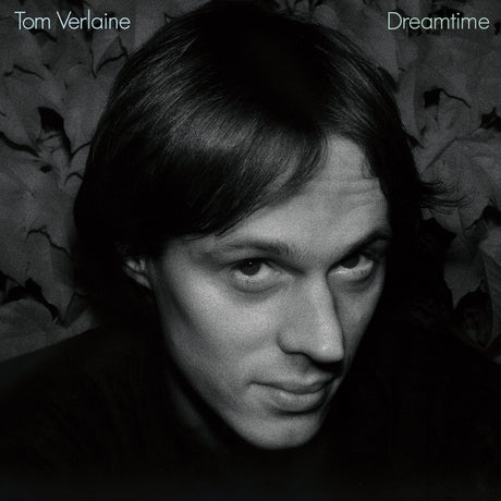 Tom Verlaine 'Dreamtime' black and white album cover featuring a close-up portrait of the artist against a dark textured background with the title text in the top corners.