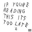 Text 'IF YOUR READING THIS ITS TOO LATE' on a white background with a black and white logo at the bottom right corner.