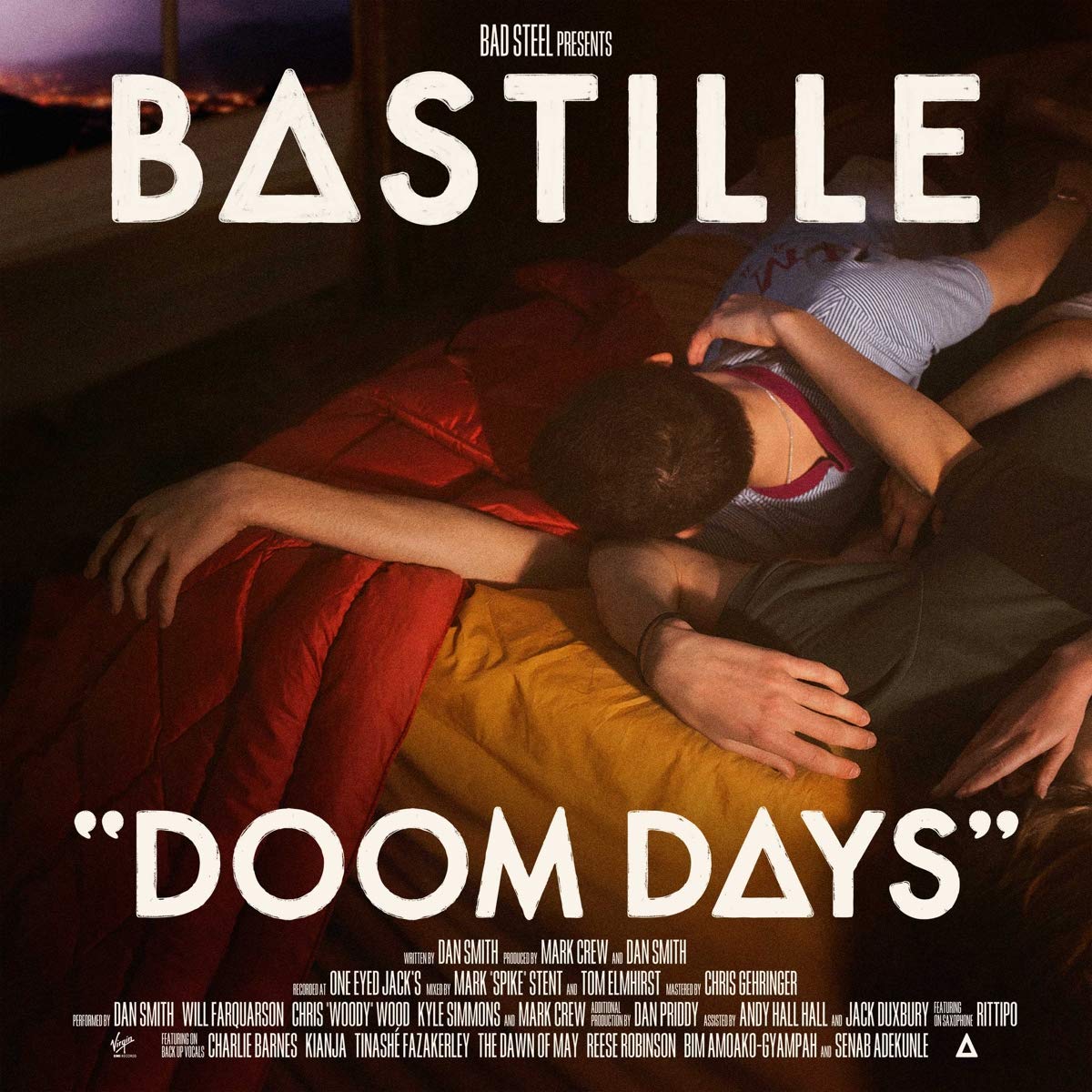 Album cover for 'Doom Days' by Bastille featuring two people lying on a bed.