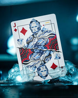 Playing card with a stylized face and red diamonds on a dark background