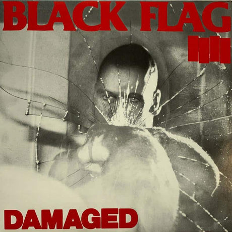 Album cover for 'Damaged' by Black Flag with a shattered glass effect and black and white image.