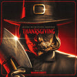 Album cover for 'Thanksgiving' with a person wearing a pilgrim hat and holding a gun.