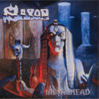 Album cover for Saxon's 'Metalhead' with a stylized Sphinx and other figures.