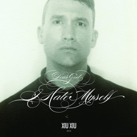 Album cover with a stylized text design and a person's face.