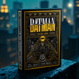 A boxed deck of Batman-themed playing cards stands upright on a wet dark surface with a blurred city skyline at night in the background. The box is black with prominent gold and white artwork and text reading 'Batman' and 'The Theory Playing Cards'.